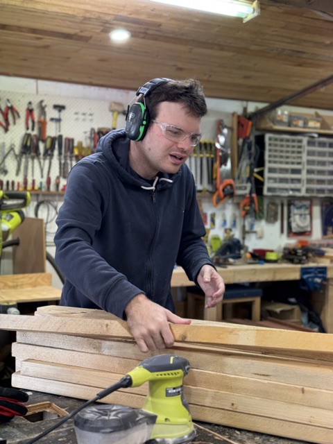 Liam showing off the finished birdhouse